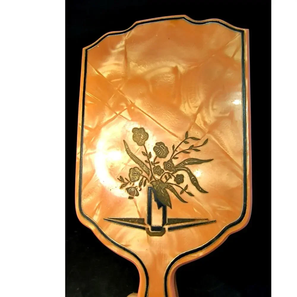 1966.  Art Deco Hand Mirror Pearlized Celluloid by Dupont Coral Pink and Black